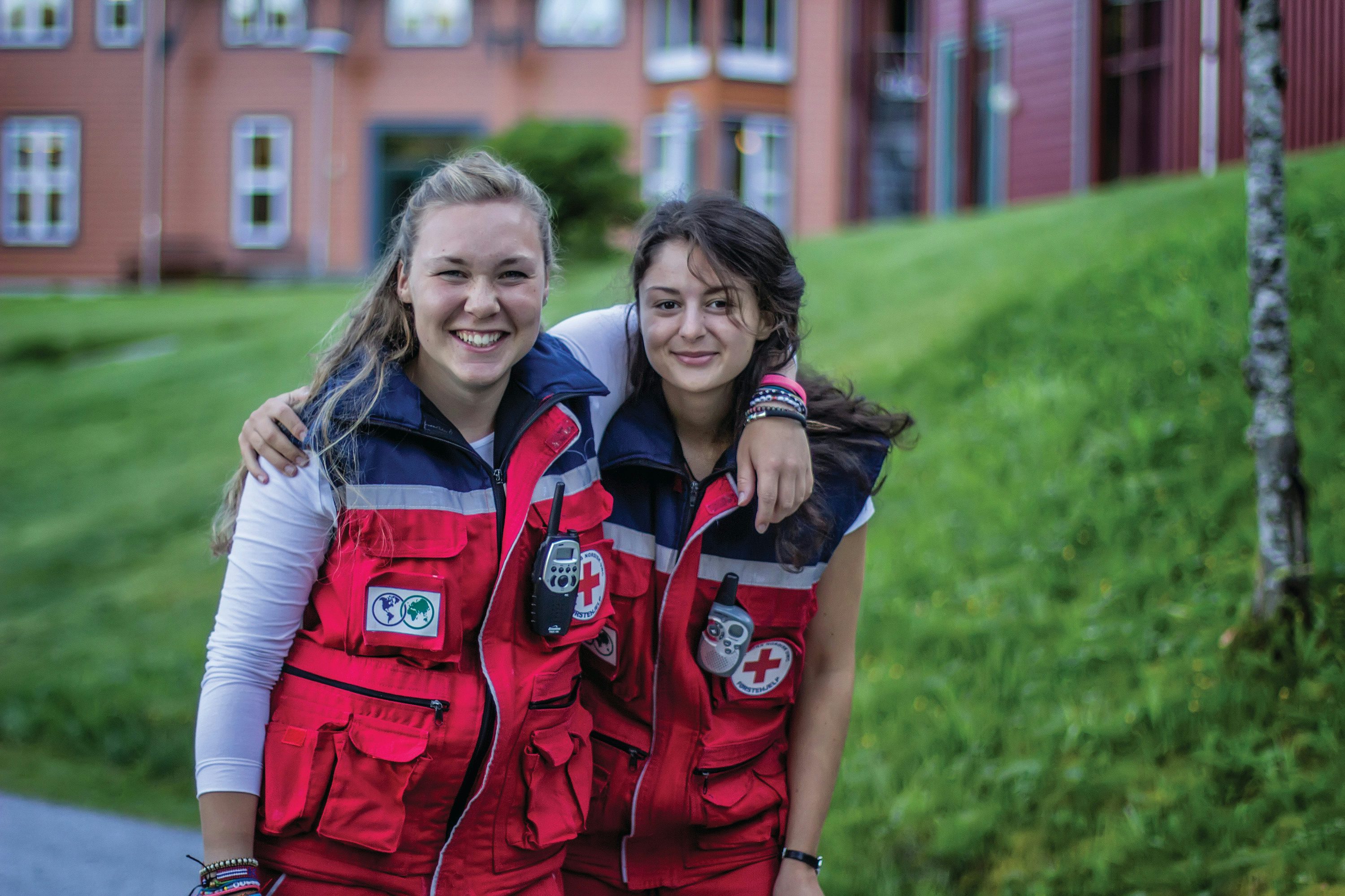 Two students dressed as paramedics have their arms wrapped around each other